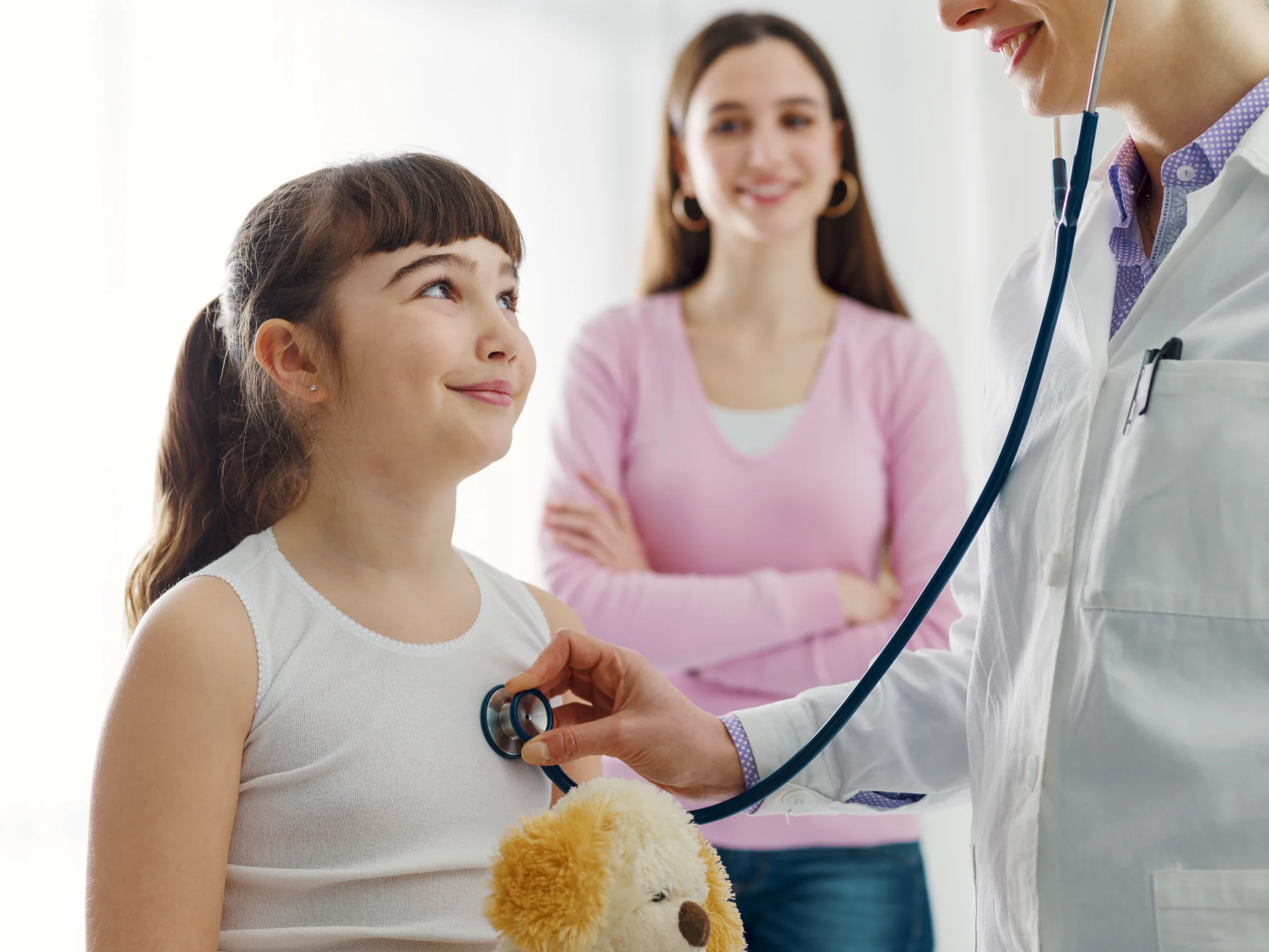 Pediatrician Dr. Jennie Chung conducting a well child checkup at Happy Bun Pediatrics in McKinney TX